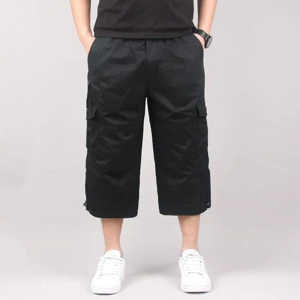 Men's loose-fit cotton cropped casual pants in khaki colour, shown on a size chart.