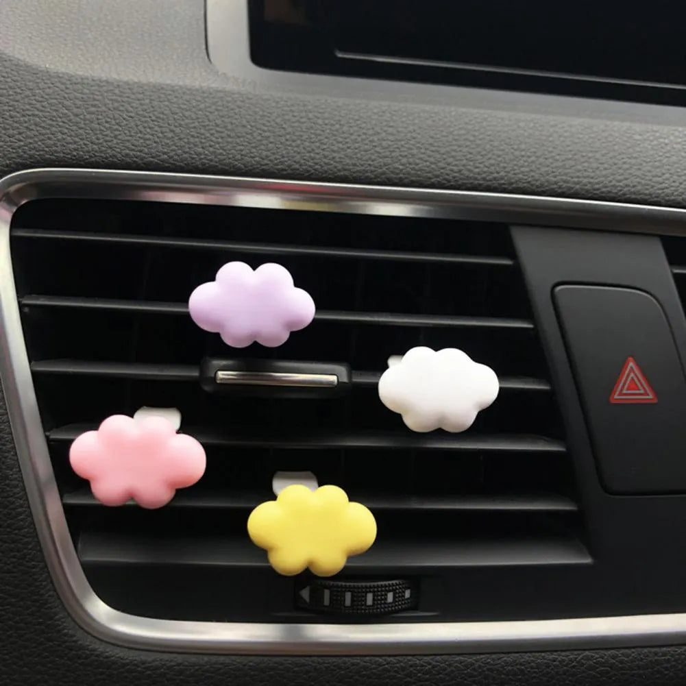 Resin car air vent fragrance clip in cartoon design, 17mm by 27mm, shown in one of six colours.
