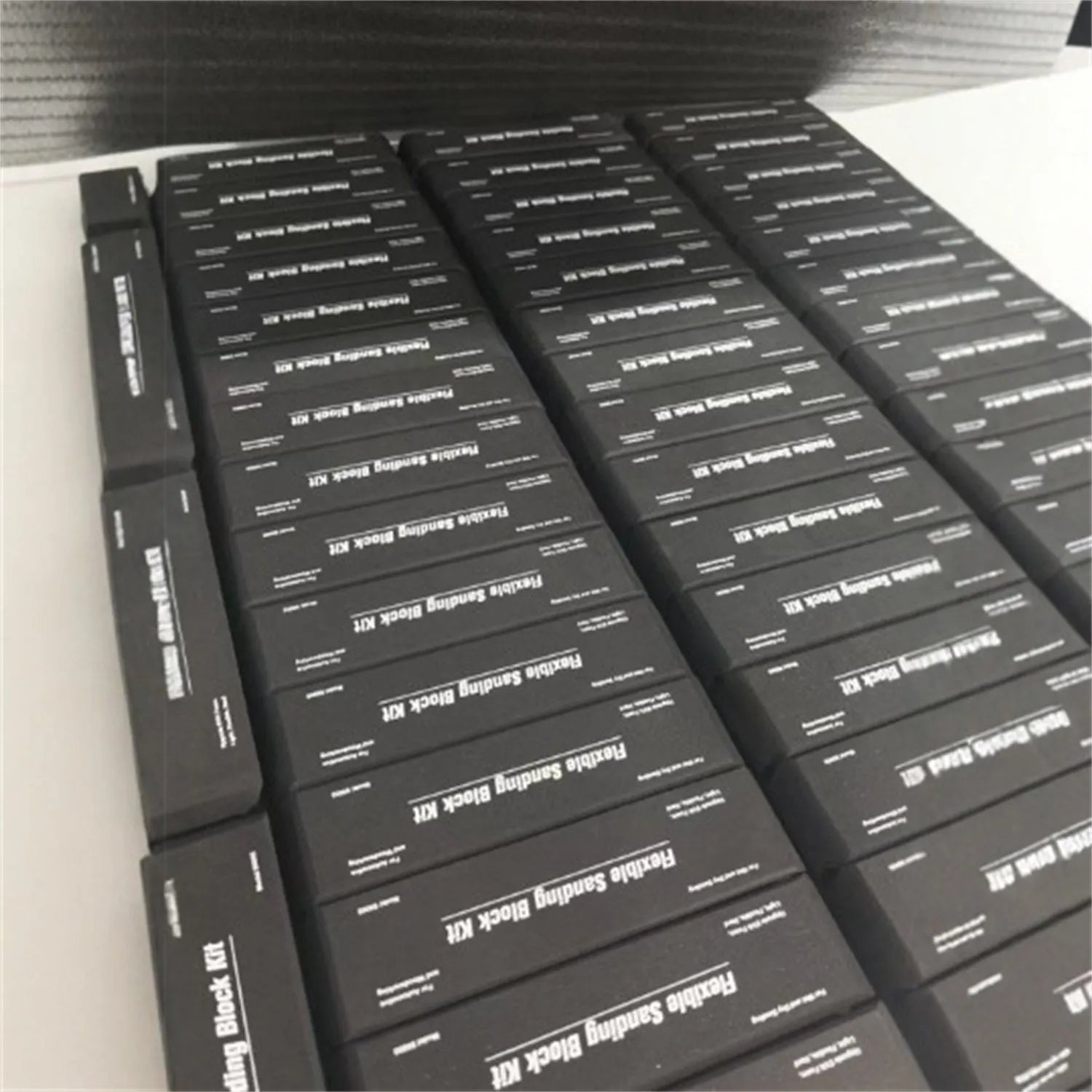 Set of seven black frosted EVA display blocks with metal construction for photography and staging.