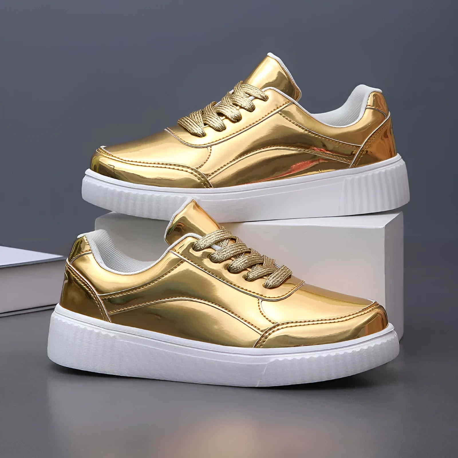 Rose gold platform sneaker with sequin details and a thick, light-coloured sole.