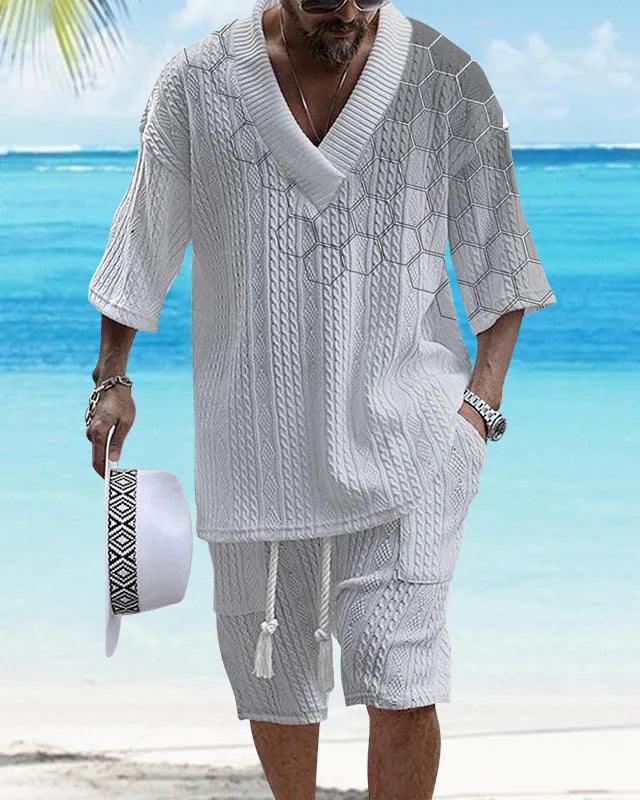 Men's grey printed knitted short-sleeved top and matching shorts on a hanger.