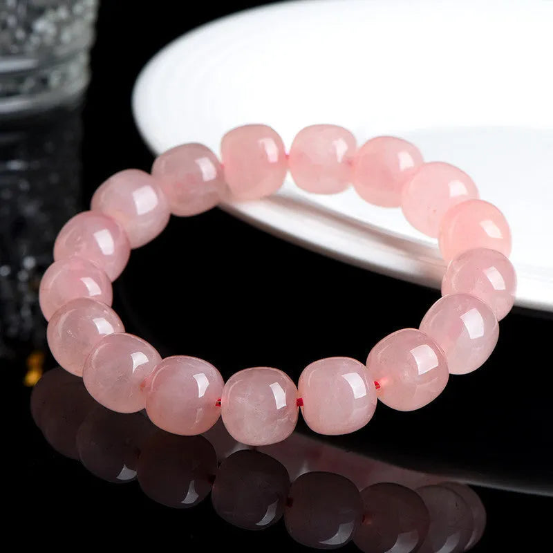 Pink natural crystal barrel bead bracelet with 8x10mm geometric design and polished finish