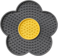 A blue flower-shaped silicone lick mat for pets with four white suction cups on the underside.