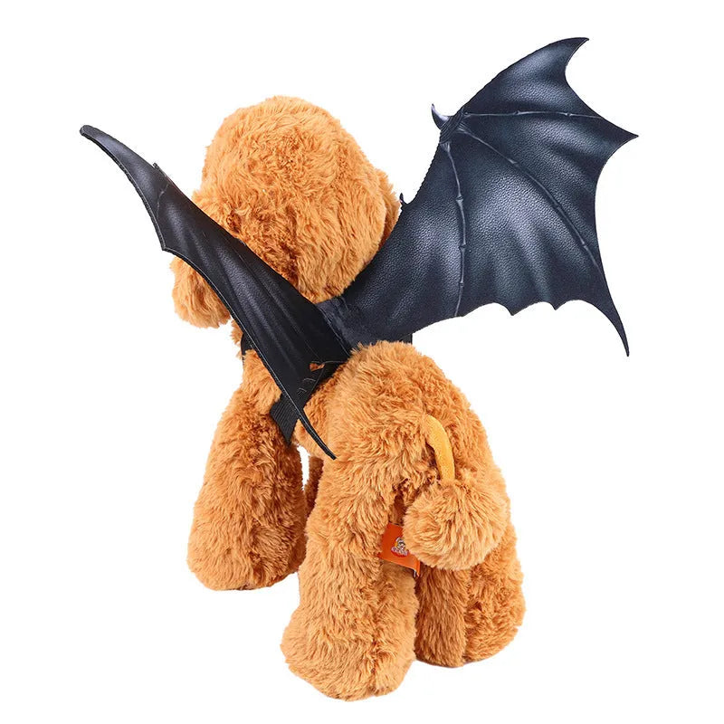 Black fabric bat wing costume for a pet dog or cat, showing elastic straps.