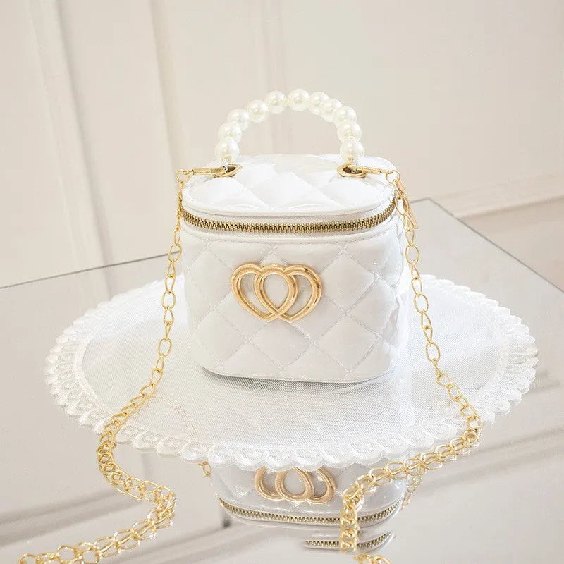 Transparent PVC bucket bag with a heart pattern, shown in one of seven available colours.