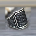Black alloy ring with copper inlay and zircon stones, shown in a unisex European American design style.