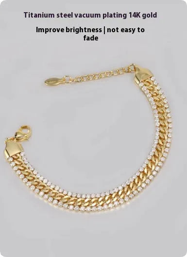 Gold titanium steel tennis bracelet with artificial gemstone inlay on wrist