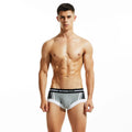 Men's low waist cotton boxers in dark blue, light grey, and red colours showing hip-lifting design