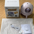 Light purple astronaut-themed USB humidifier with colourful LED lights on desktop