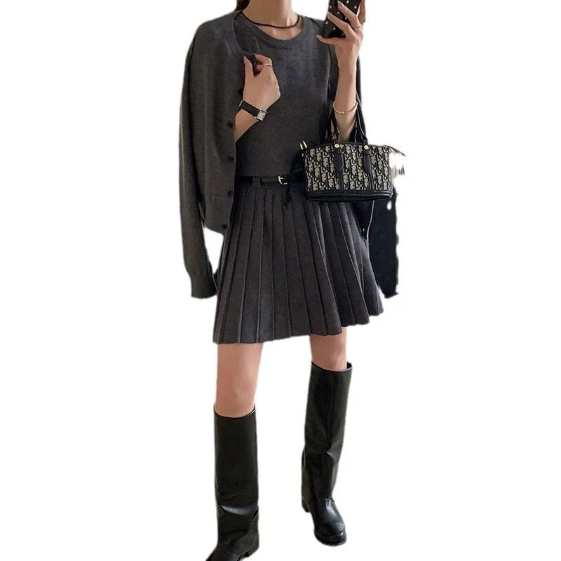 Women's grey knitted two-piece set with vest skirt and long-sleeved cardigan in art retro style