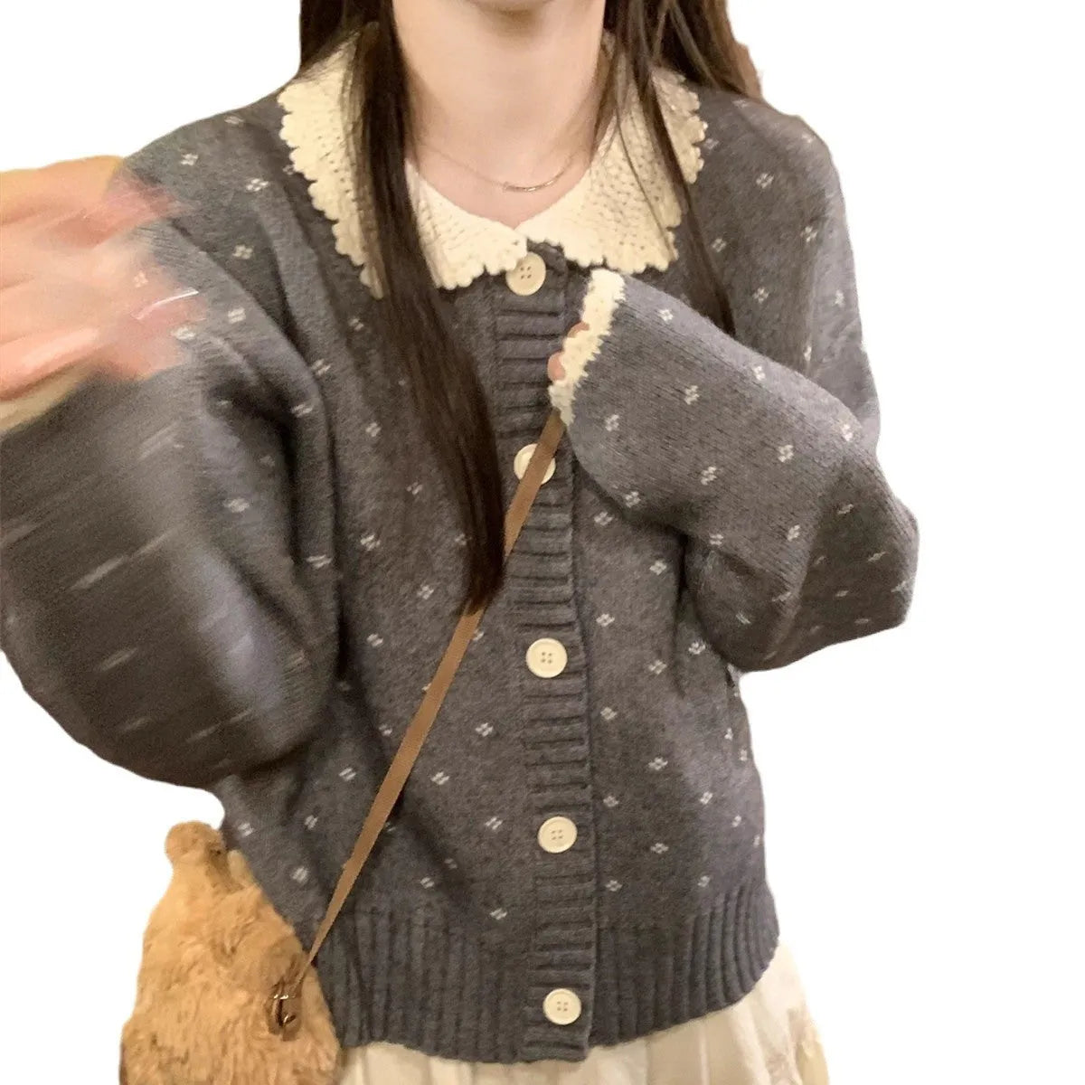 Retro floral patterned knitted cardigan coat with a Peter Pan collar and button front.