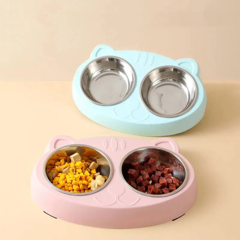 Blue plastic dual-bowl pet feeder tray for cat food and water on a white background.