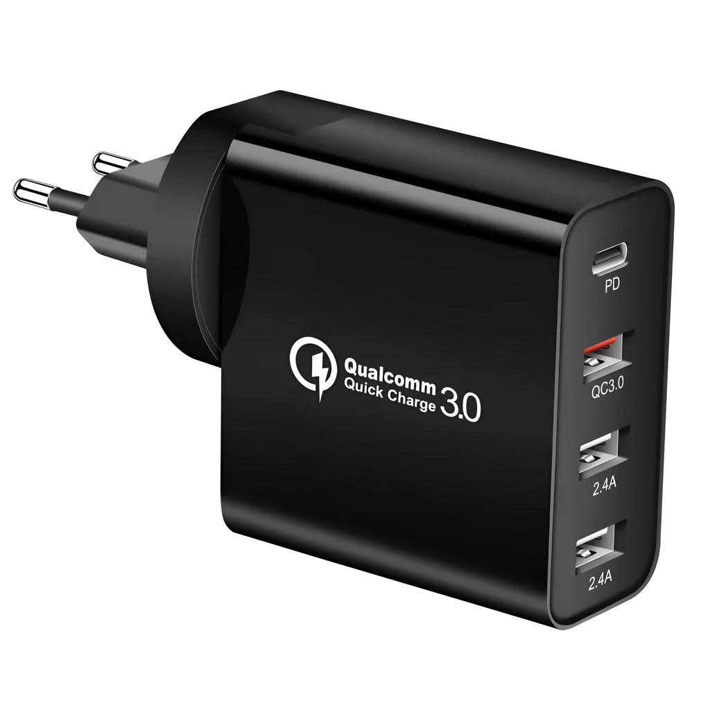 White multi-port USB fast charger with UK plug showing PD and QC ports on a table.