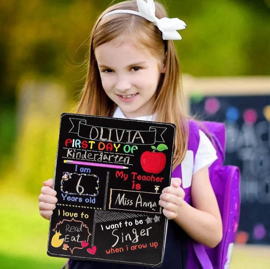 Wooden first day of school blackboard ornament measuring 25.5 by 30 centimetres.