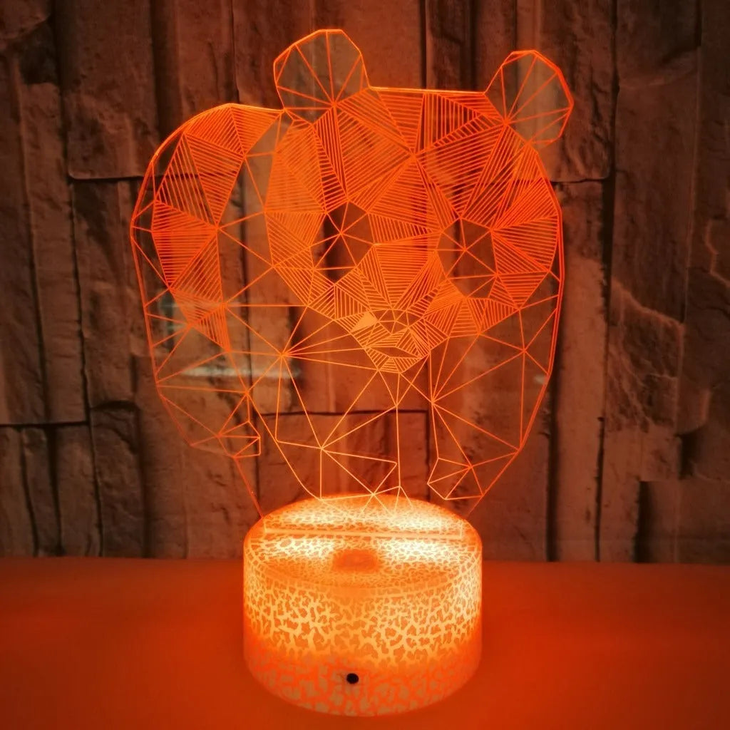 Panda colorful LED 3D night light with remote control showing seven colour gradient on a bedroom shelf