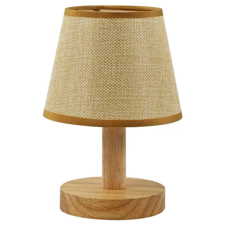 Vintage pleated table lamp with jute and linen shade on bamboo base, featuring USB charging and three-colour dimming.