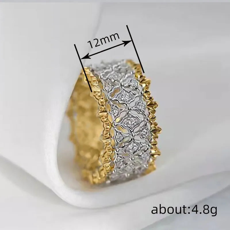 Geometric copper zircon ring with two-tone gold electroplating showing round centre stone