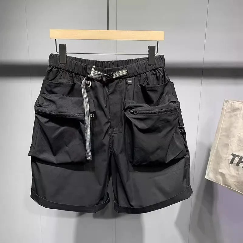 Men's loose-fitting black workwear shorts with pockets, featuring a non-iron finish and a mid-waist design.