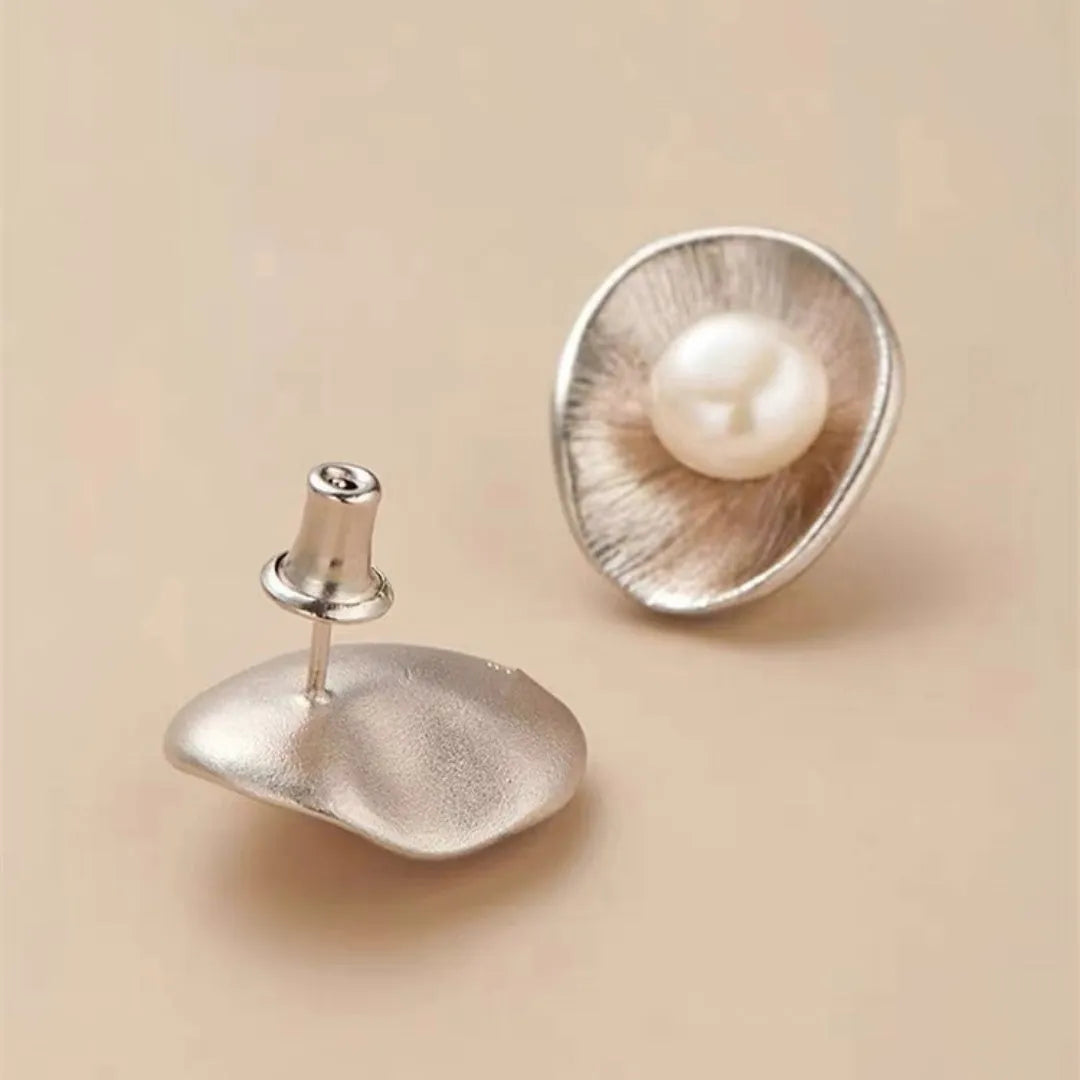 Pearl sterling silver needle earrings with geometric design and gold electroplated finish