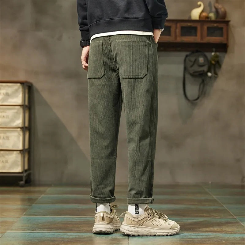 Corduroy men's casual straight-leg trousers in solid colour with mid-waist rise and zipper fly