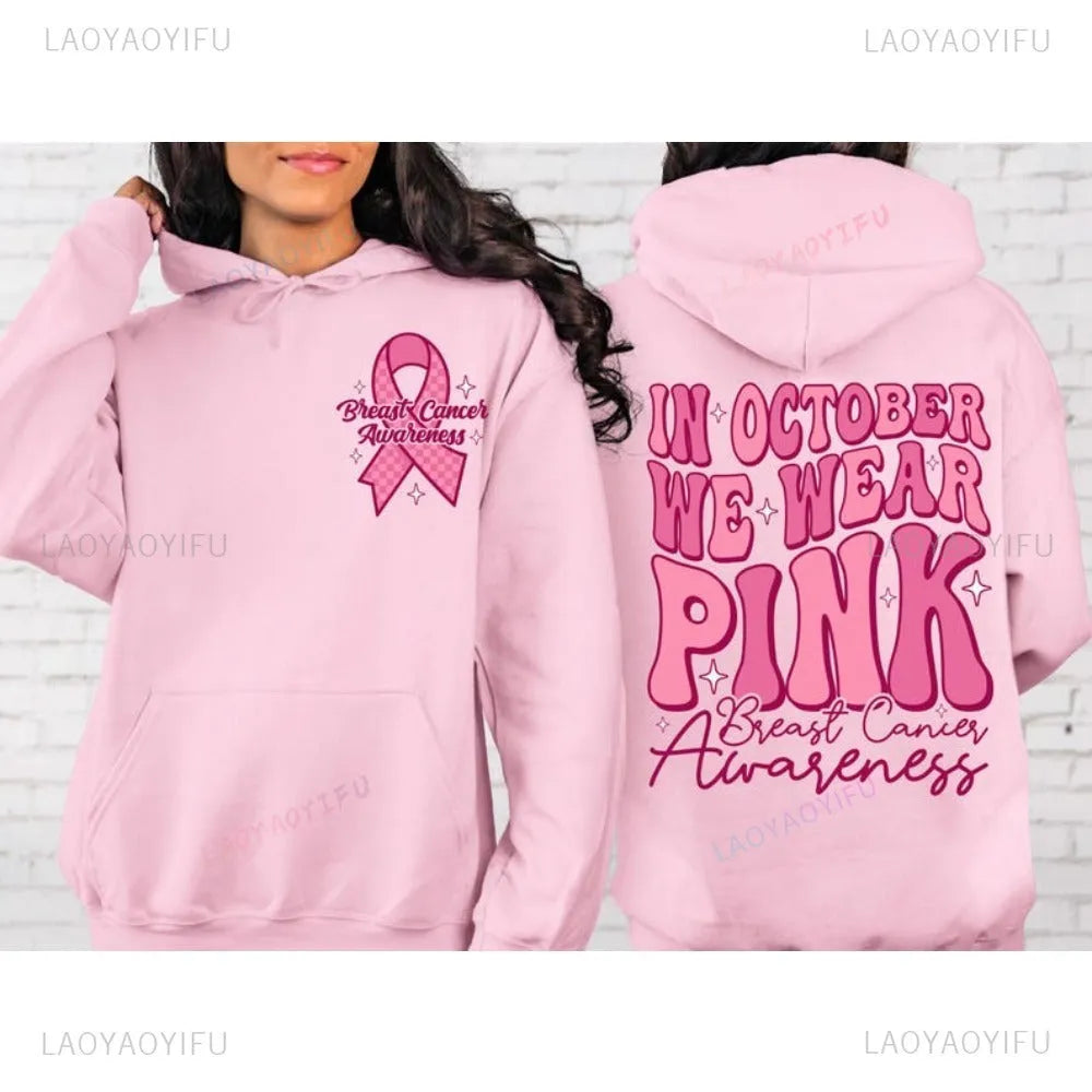 Pink breast cancer awareness pullover hoodie with retro art print and side seam pockets.