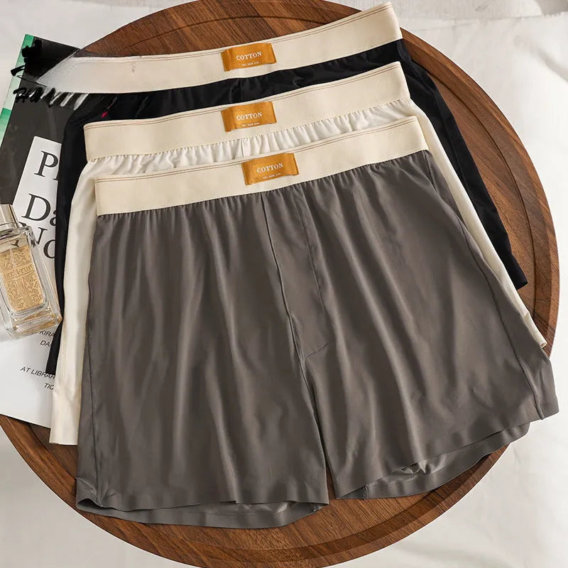 Men's loose-fit ice silk underwear in a solid colour on a mid-waist.