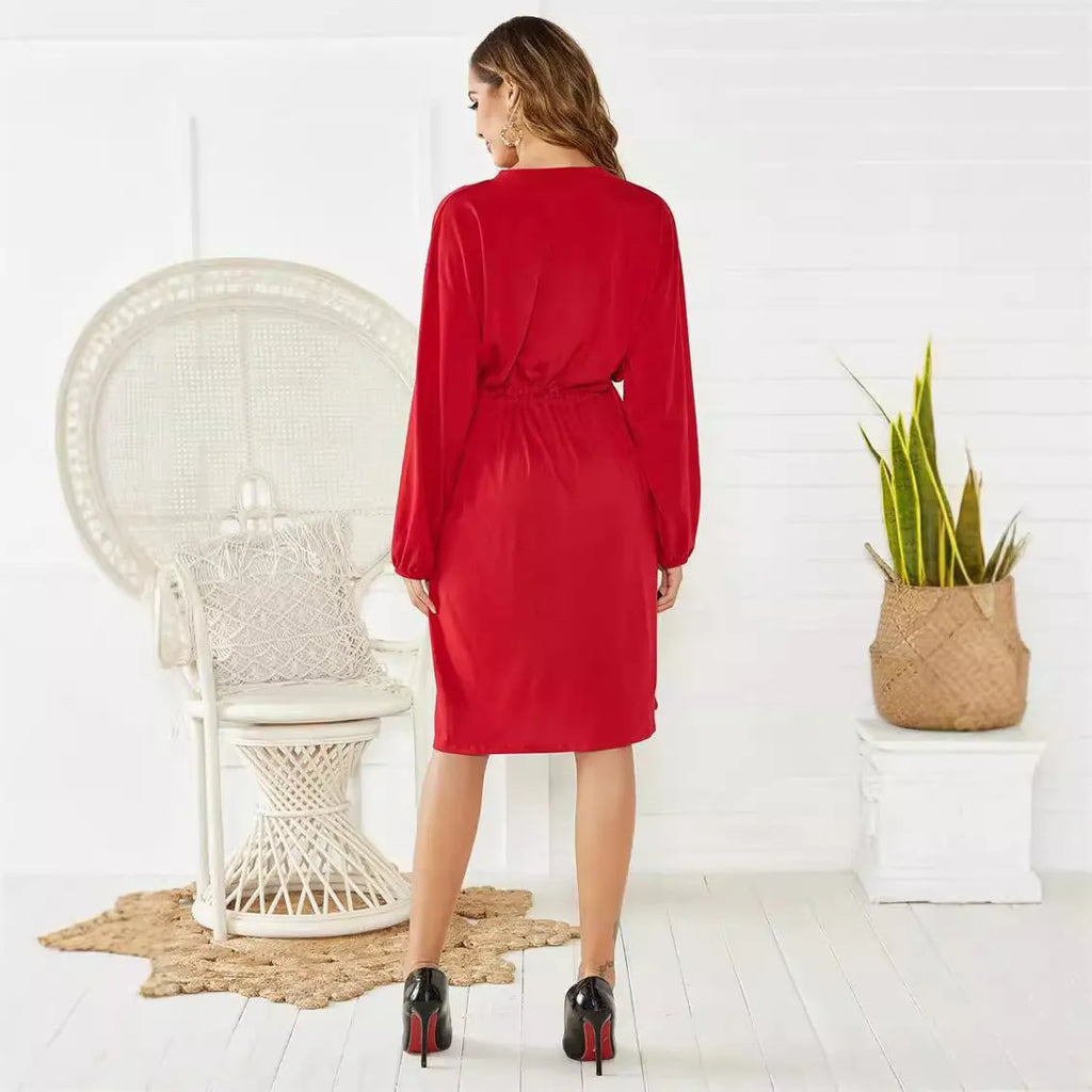 Black A-line mid-length dress with long sleeves, elastic waist, and a cinched belt.