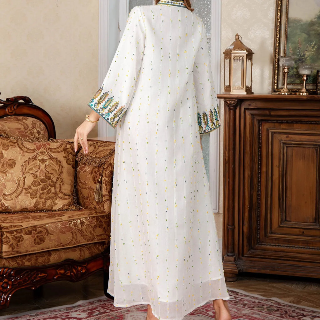 White long sleeve long skirt Arabic robe for women on a hanger.