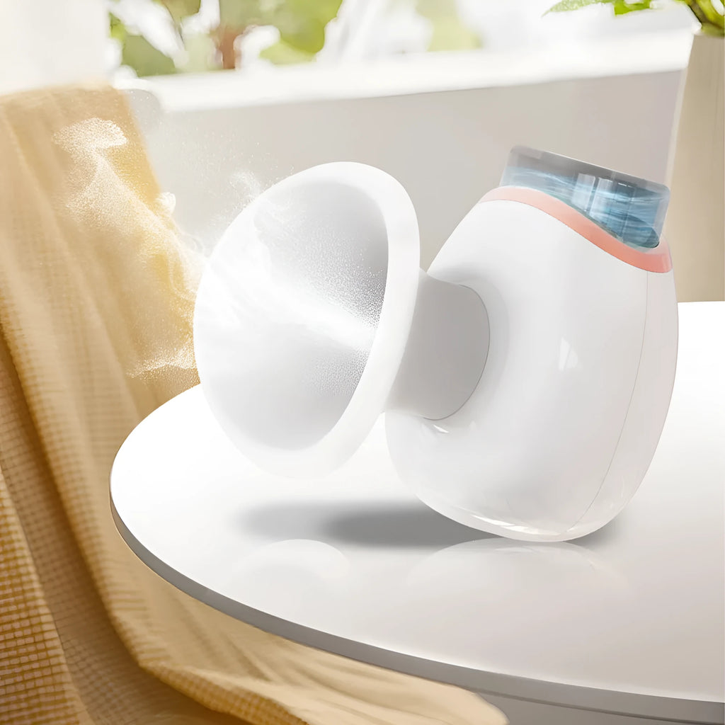 White and purple household eye humidifier with charging cable on a table.