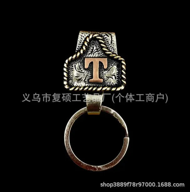 Handmade stainless steel cow tag belt key holder with engraved number plate on a split ring.