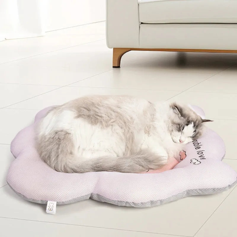 Green pet cooling mat for dogs and cats with fabric cover, shown next to a tape measure indicating its size.