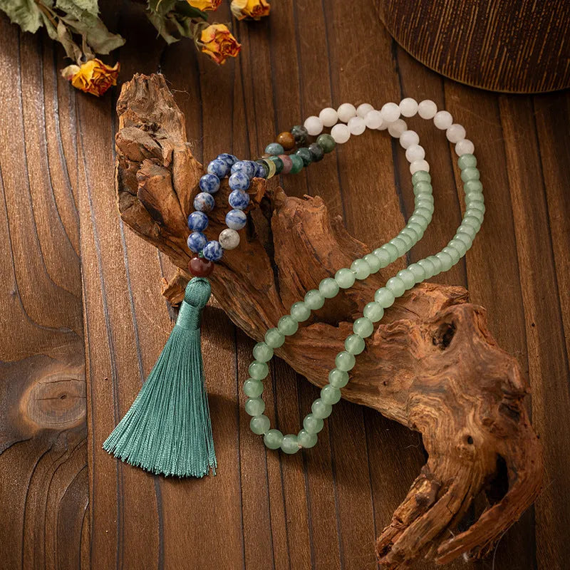 Vintage bohemian style natural stone bead necklace and bracelet set showing geometric round beads and tassel detailing