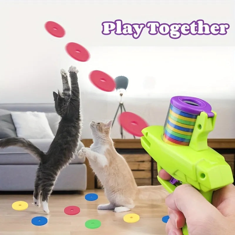 Battery-free motorised interactive cat toy launcher with soft foam discs in purple and green colour options.