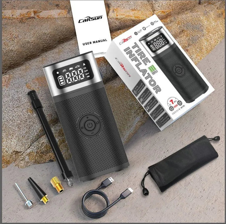 Black portable wireless air pump with metal construction, USB charging port, and 15cm inflation tube