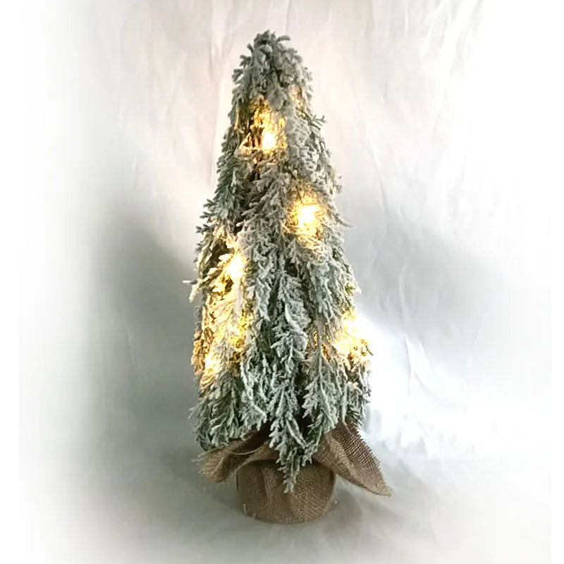 Small 24-inch artificial Christmas tree with battery-powered lights and PE simulated snow spray on branches