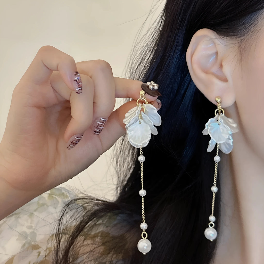 Women's acrylic earrings with pearl and shell tassel design measuring 8.8cm length