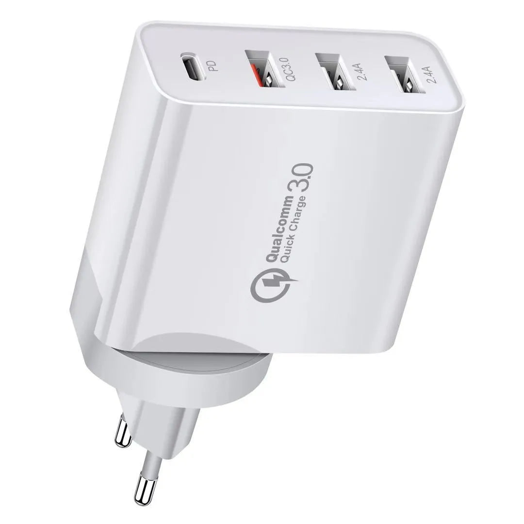 White multi-port USB fast charger with UK plug showing PD and QC ports on a table.