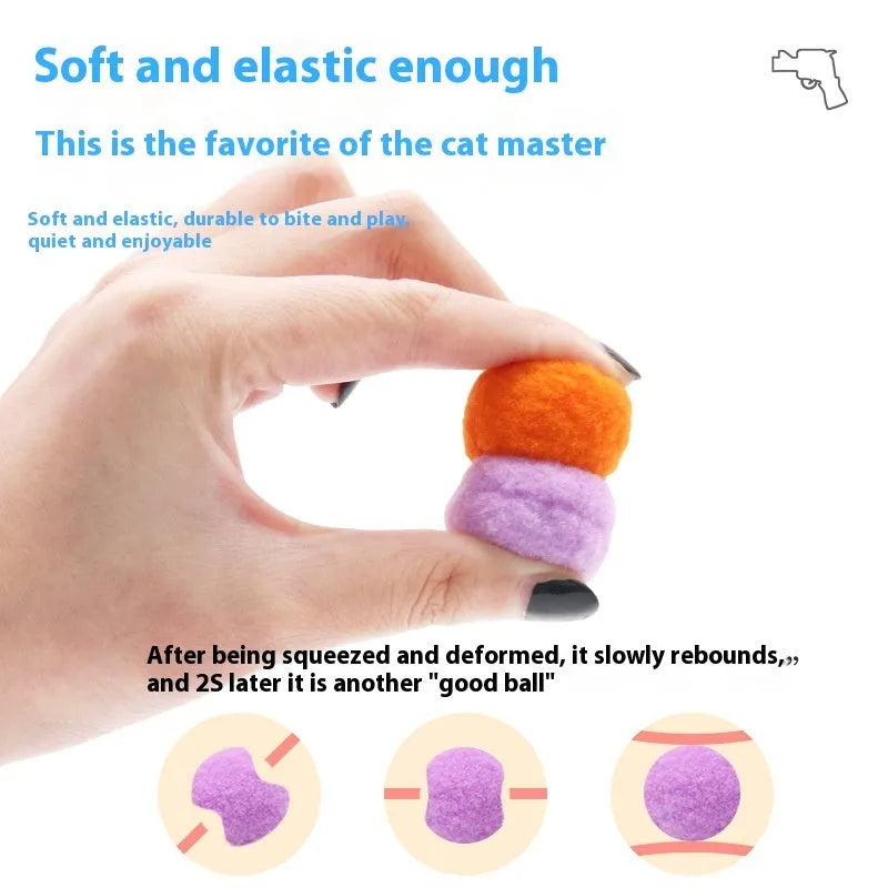 Pet toy launcher gun and soft plush balls for interactive play with cats and dogs.