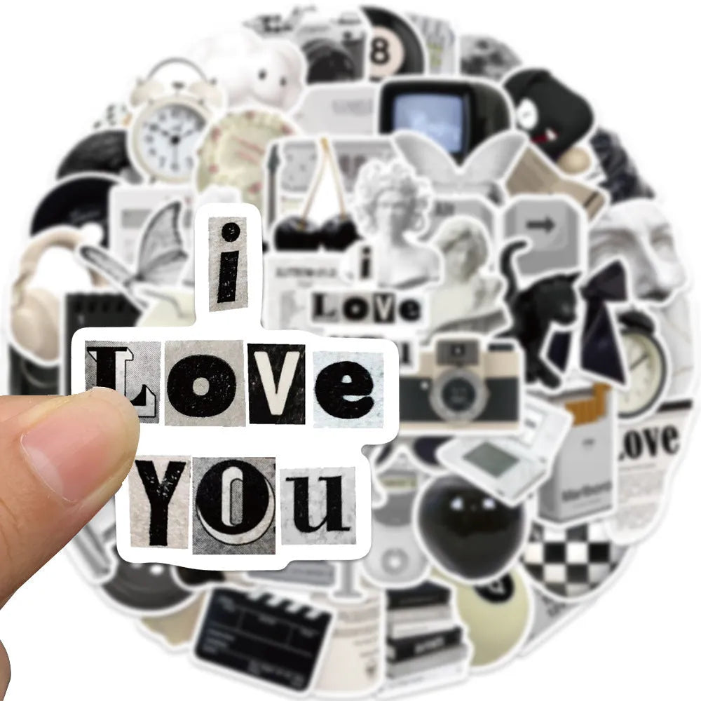 Assortment of 61 black and white waterproof PVC stickers for laptops, phones, and travel gear.