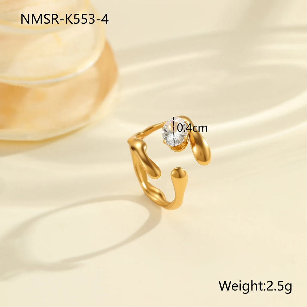 Geometric open mouth stainless steel zircon ring in a free size on a hand.