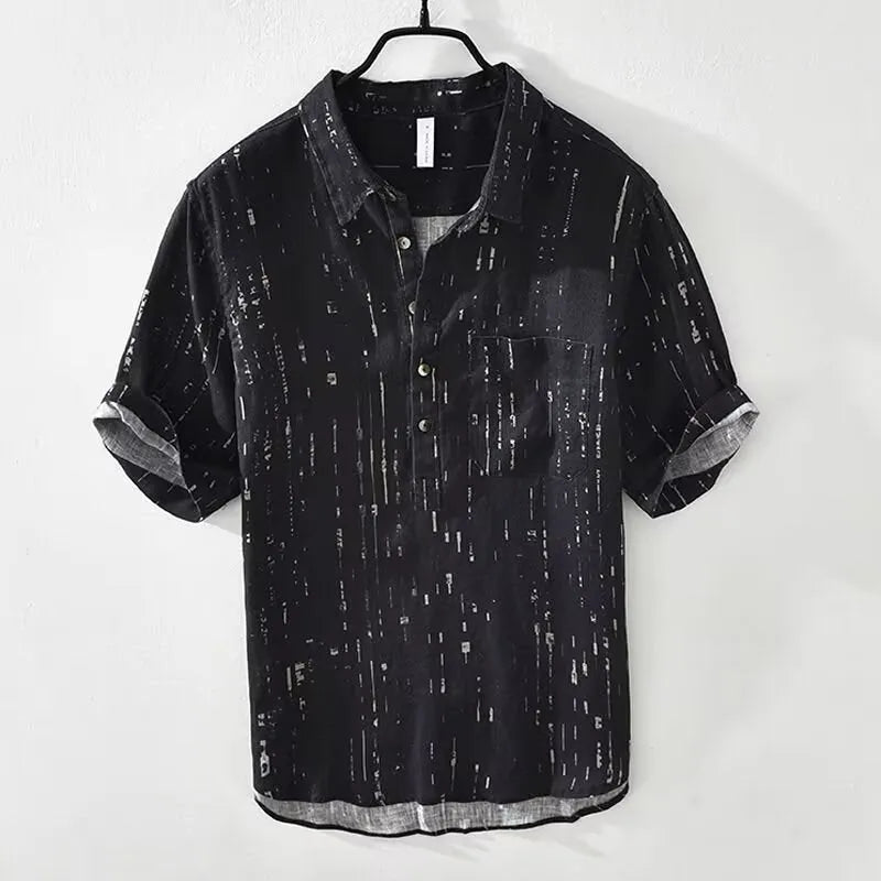 Man wearing a loose-fit black short-sleeved polo shirt, cardigan style, for casual summer wear.