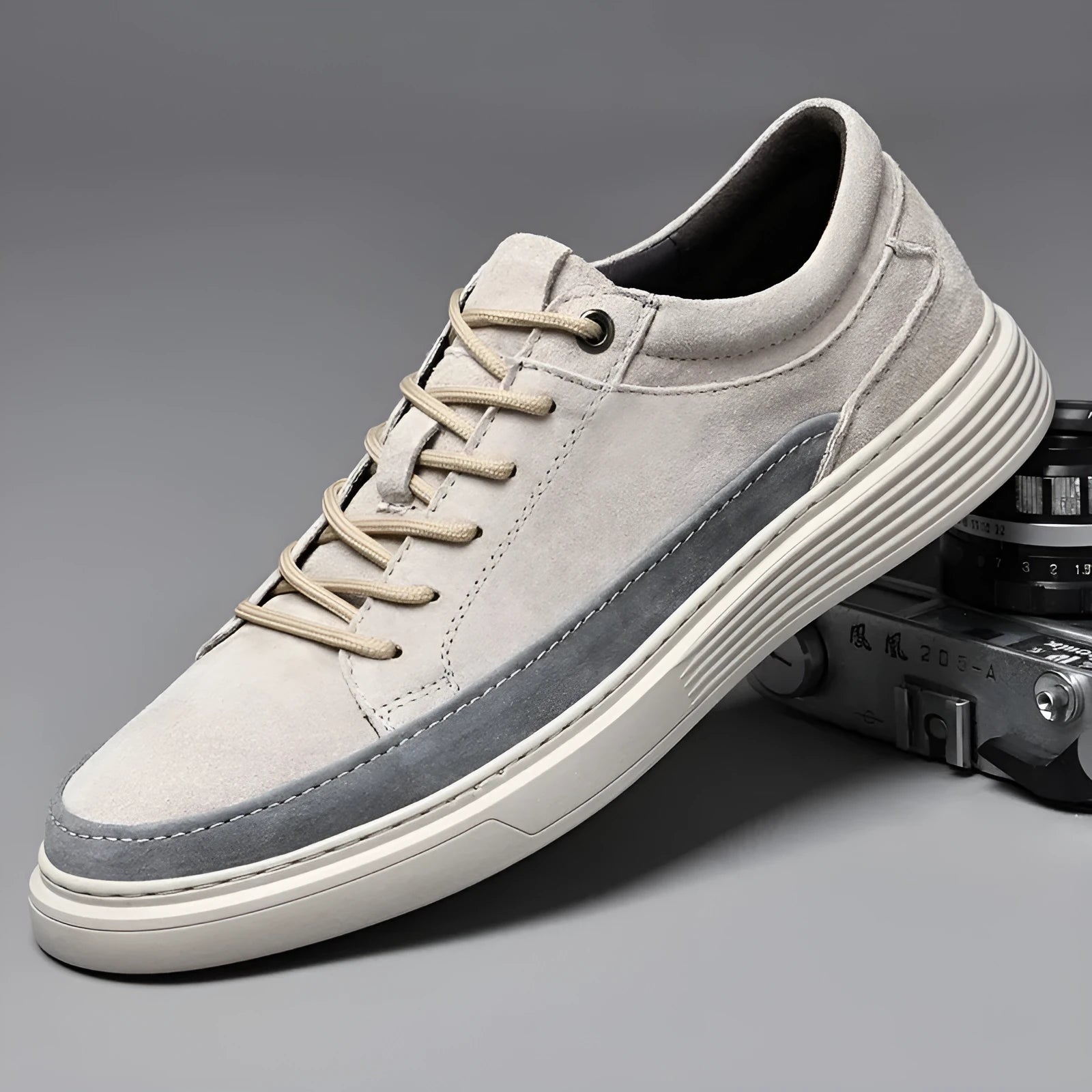 Men's grey casual skate shoes with pigskin upper and rubber sole showing lace-up front design