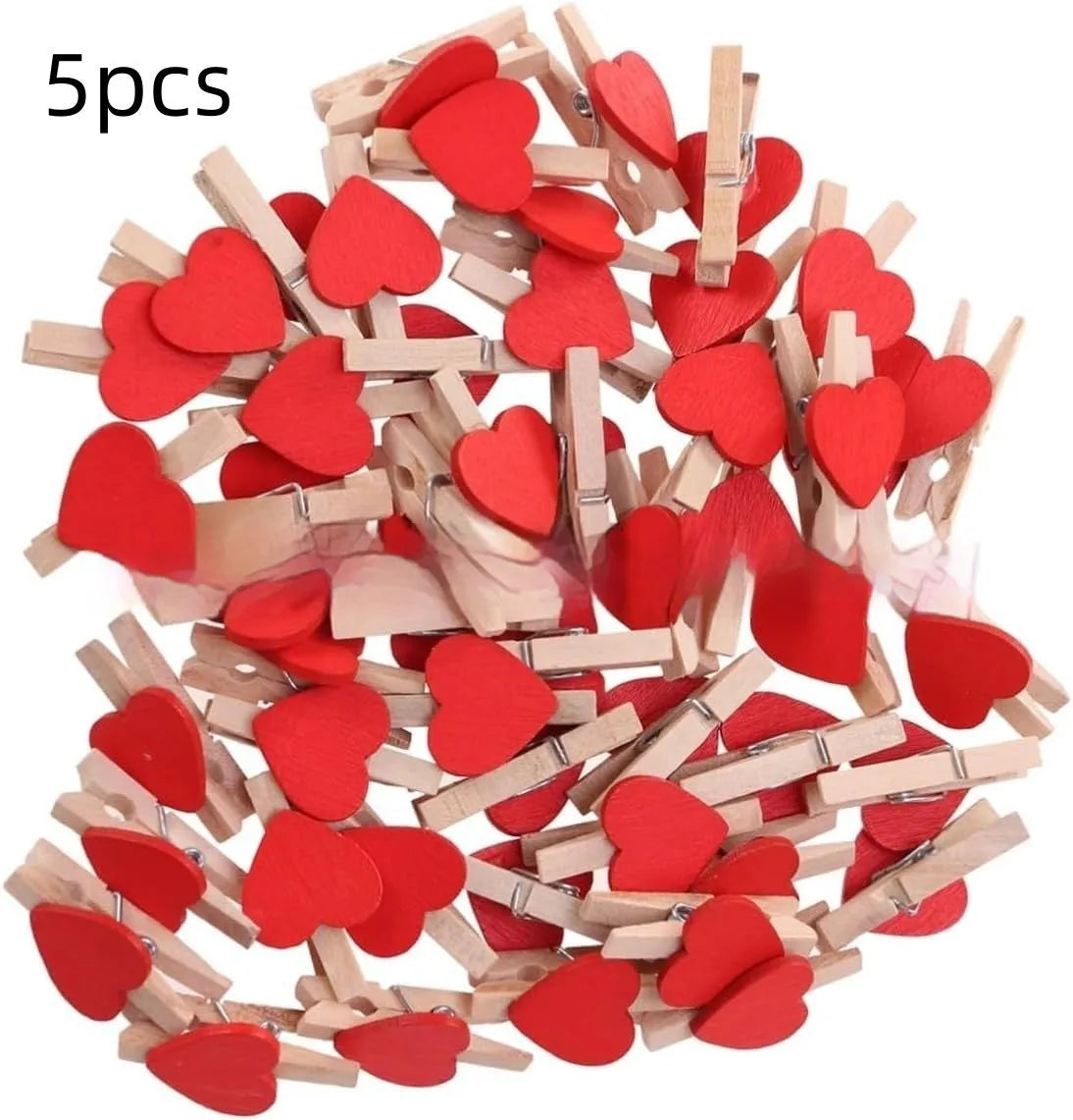 Five handmade solid wood heart-shaped clips in red, white, and pink on a wooden surface.