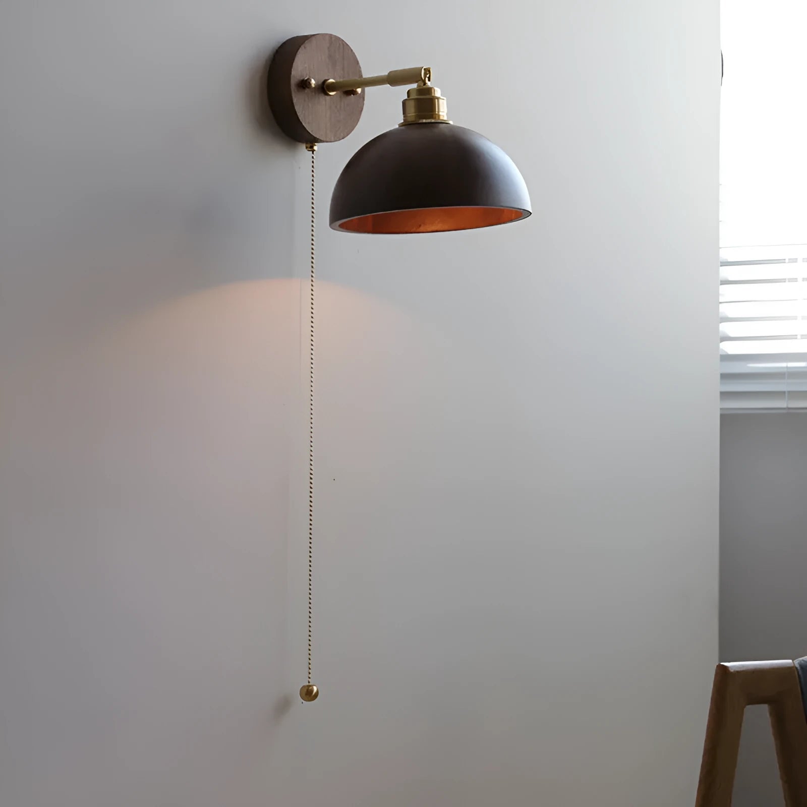 Inn Niche Nordic style wooden finish wall mounted bedside lamp with a neutral shade.