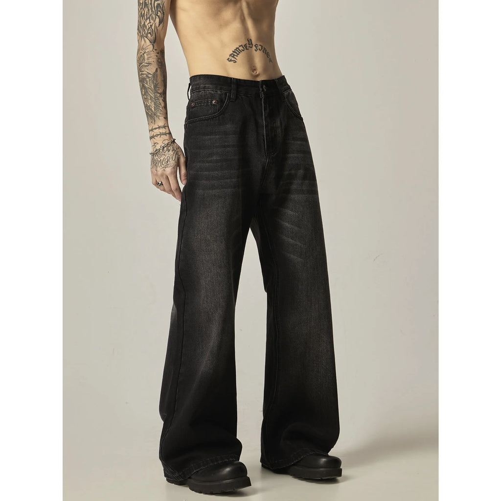 Black straight leg jeans with loose retro styling and basic zip fly design
