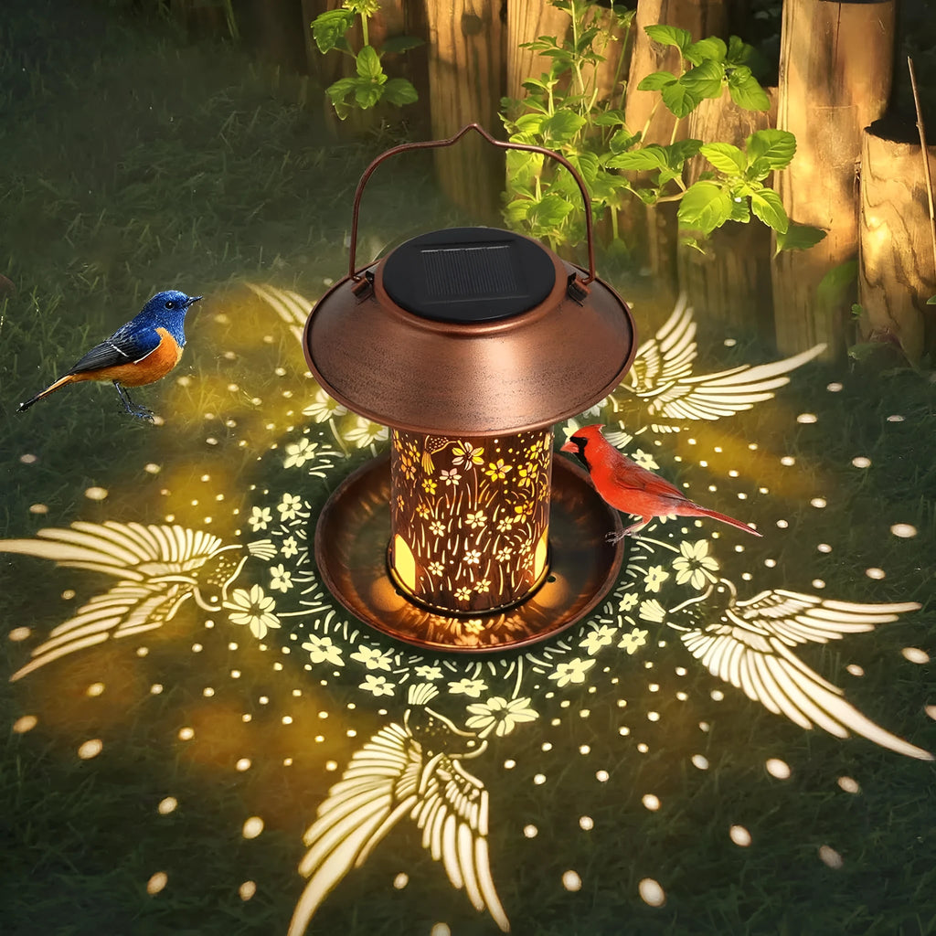Solar-powered iron art hummingbird garden feeder lamp with waterproof IP65 rating.