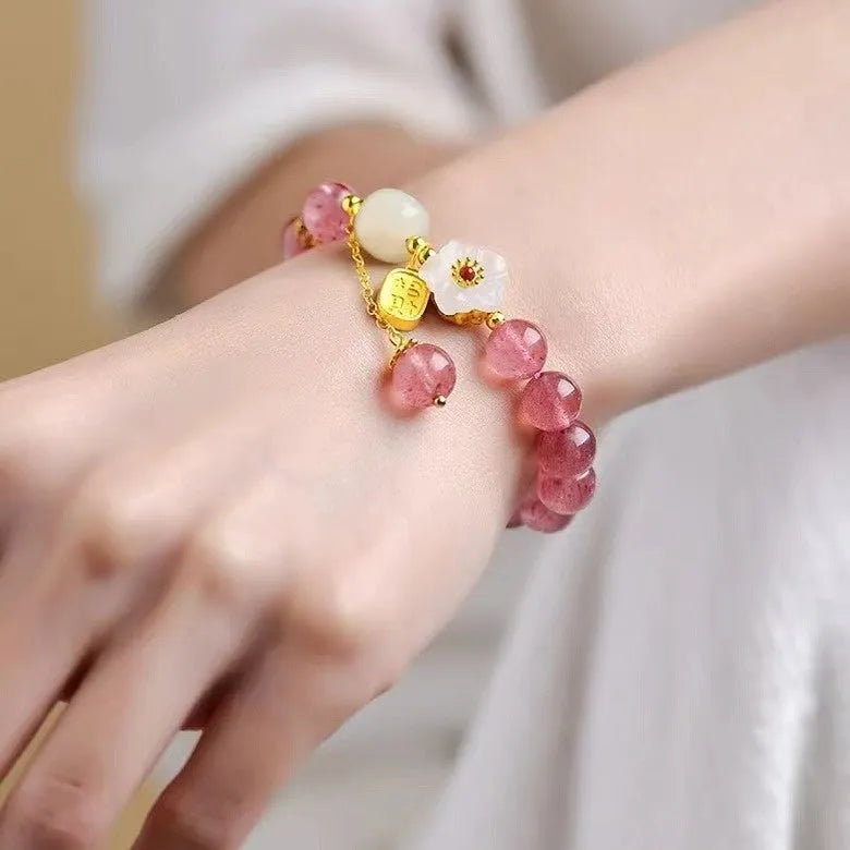 Handmade strawberry quartz crystal bracelet for women showing five natural stone design variations