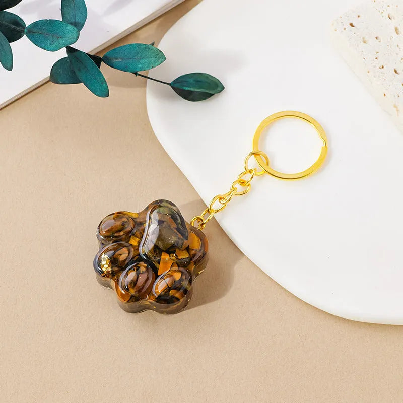 Natural crystal cat's paw keychain pendant in assorted gemstone colours on a keyring.