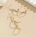 Geometric spiral design gold electroplated alloy earrings for women with ellipse decorative elements
