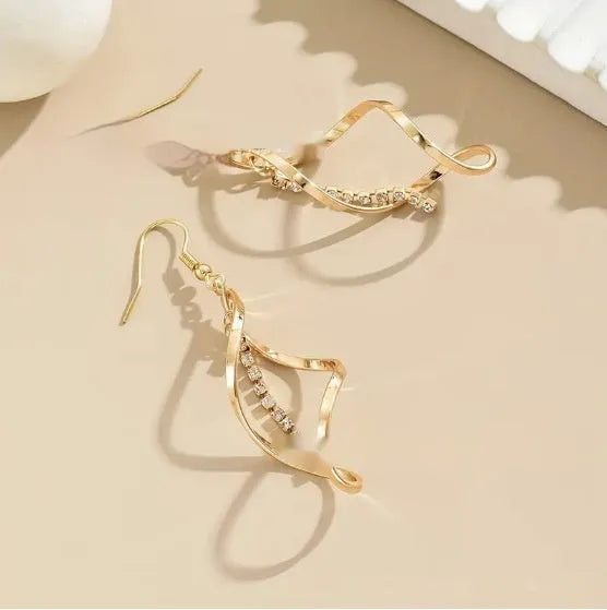Geometric spiral design gold electroplated alloy earrings for women with ellipse decorative elements
